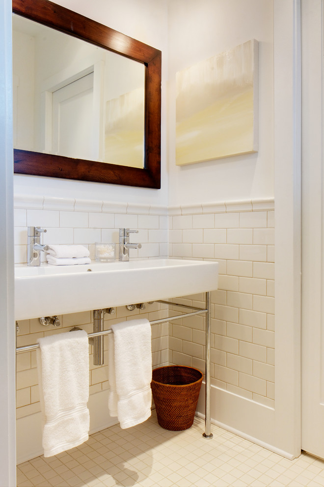 Design ideas for a mid-sized country master bathroom in Chicago with white tile, ceramic tile, white walls, ceramic floors, a trough sink and solid surface benchtops.