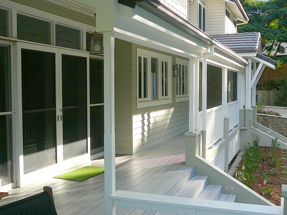 Large traditional two-storey white exterior in Brisbane with wood siding.