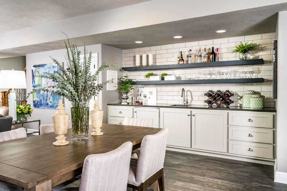 Basement - mid-sized transitional walk-out porcelain tile basement idea with gray walls, a standard fireplace and a stone fireplace