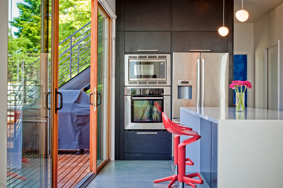 Photo of a contemporary kitchen in Seattle with stainless steel appliances.