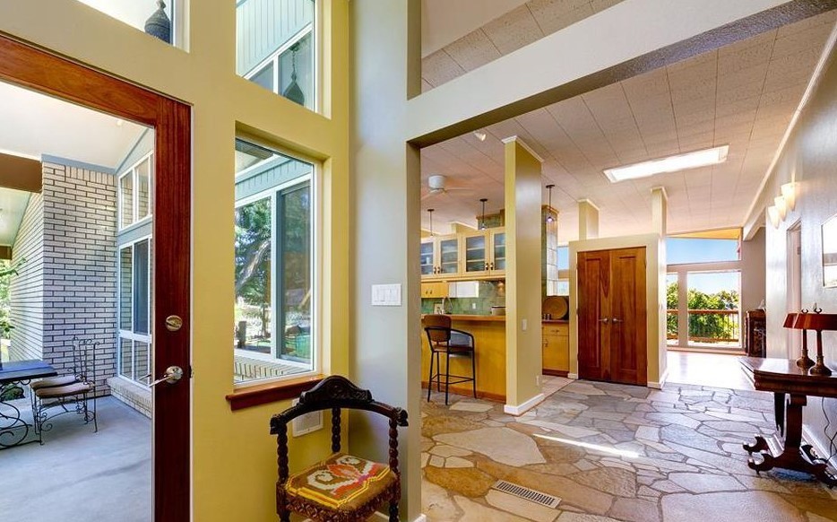 Inspiration for a mid-sized mid-century modern foyer remodel in Boise with a medium wood front door