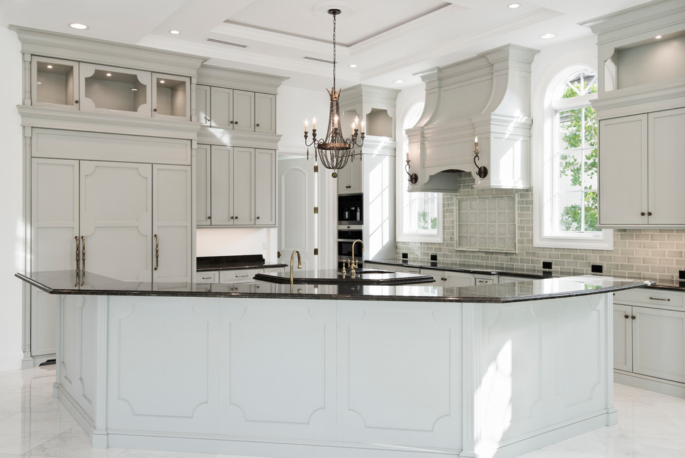 Transitional light wood floor open concept kitchen photo with stainless steel appliances and an island