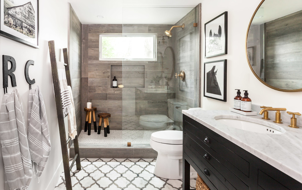 Inspiration for a small cottage multicolored tile and stone tile marble floor doorless shower remodel in Sacramento with black cabinets, a one-piece toilet, white walls, an undermount sink, marble countertops, flat-panel cabinets and a freestanding vanity