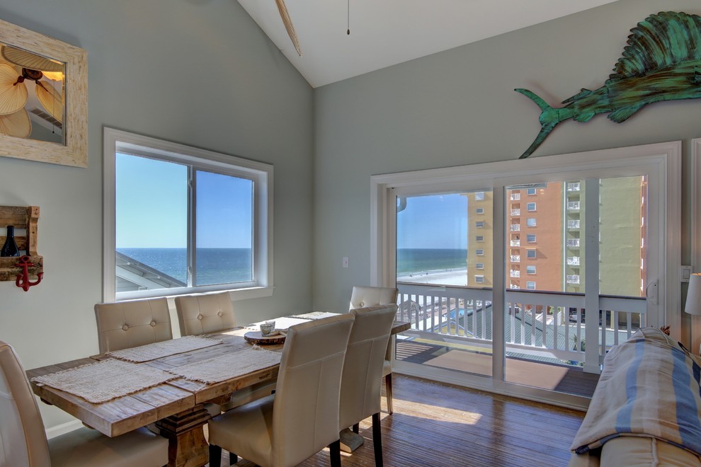 Mid-sized beach style open plan dining in Tampa with blue walls, bamboo floors and no fireplace.
