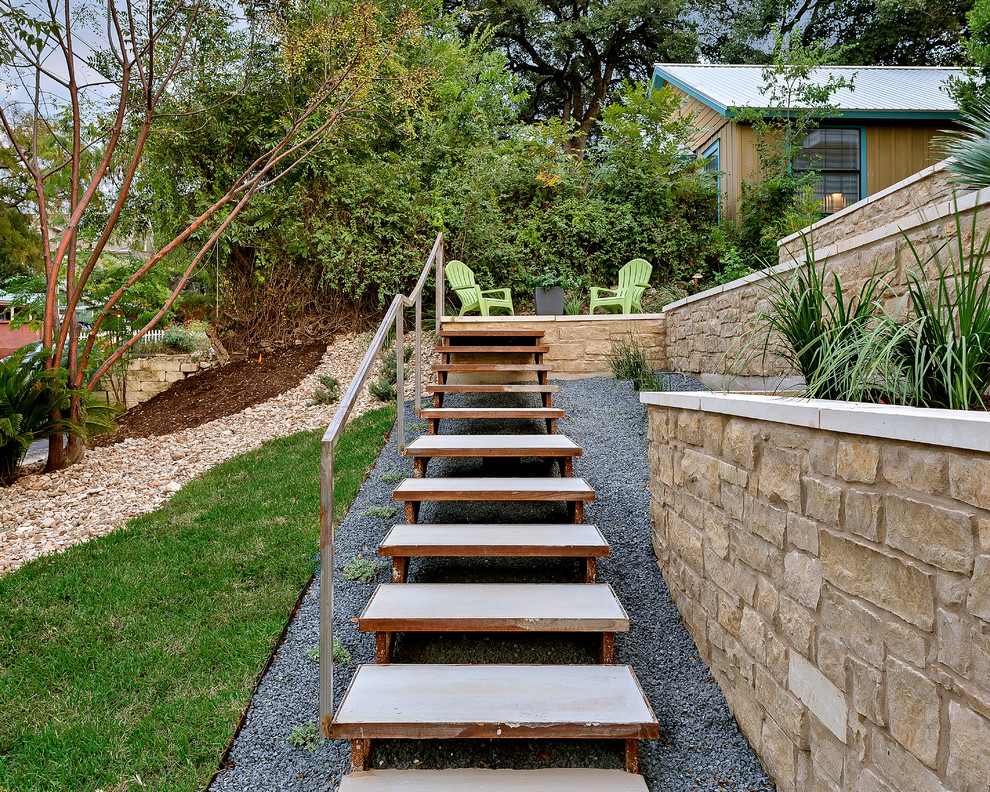 Inspiration for a mid-sized transitional side yard full sun garden in Austin with a garden path and concrete pavers.