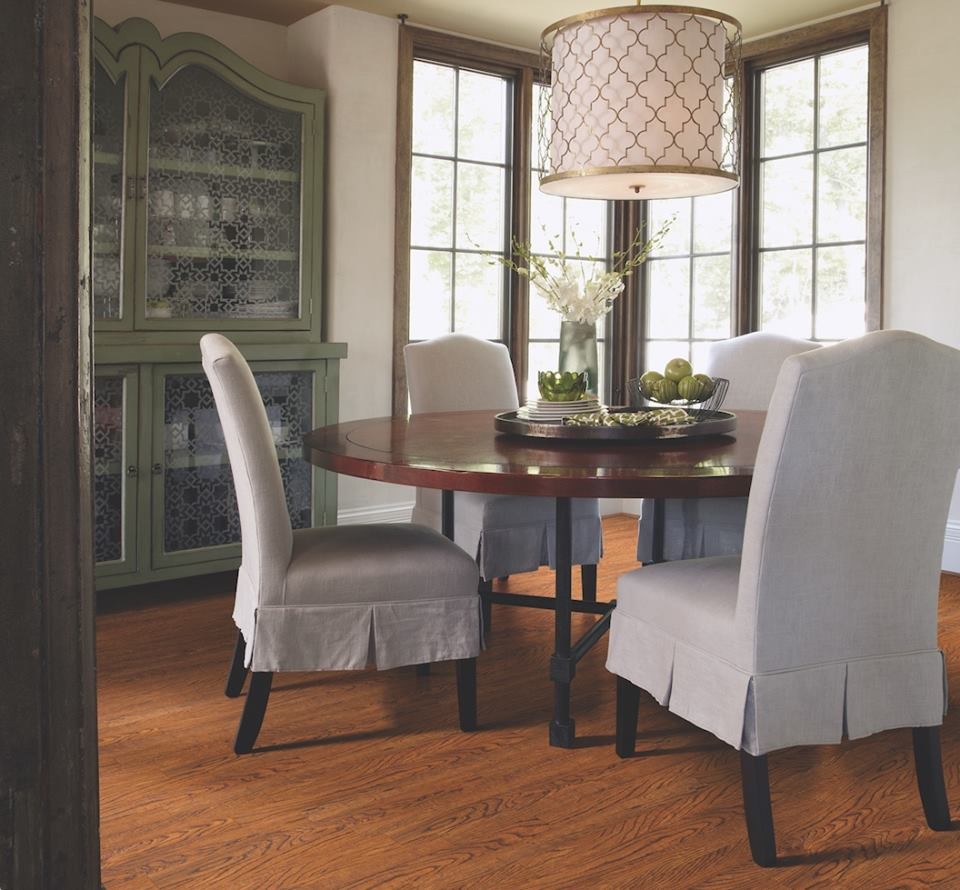 Photo of a mid-sized mediterranean separate dining room in Other with white walls and vinyl floors.