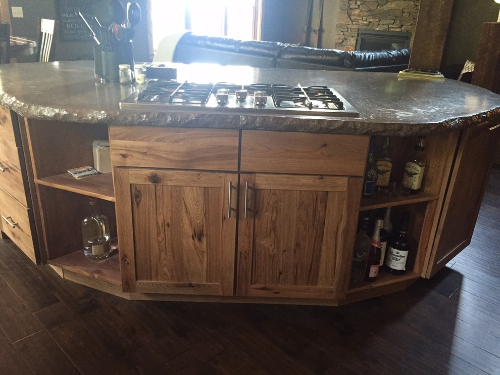 Inspiration for a mid-sized rustic l-shaped dark wood floor home design remodel with an undermount sink, shaker cabinets, medium tone wood cabinets, concrete countertops, beige backsplash, mosaic tile backsplash, stainless steel appliances and an island