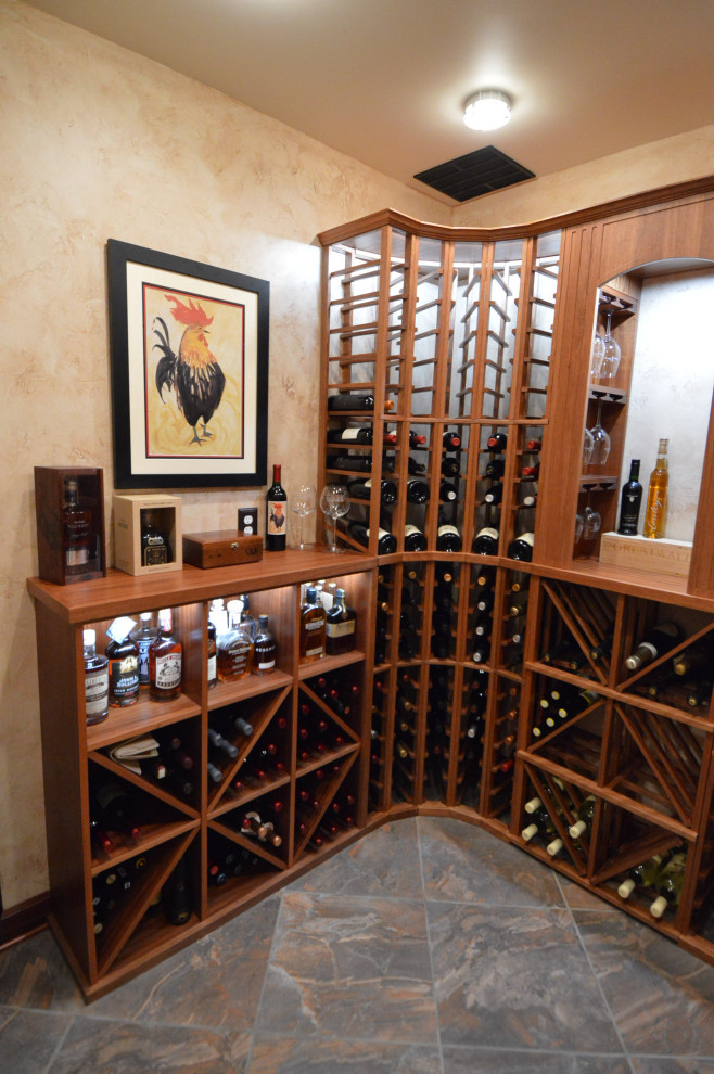 Inspiration for a mid-sized traditional wine cellar in Richmond with ceramic floors and storage racks.