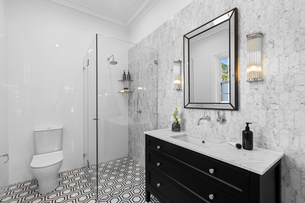 Photo of a medium sized victorian shower room bathroom in Sydney with shaker cabinets, black cabinets, a corner shower, a two-piece toilet, white tiles, mosaic tile flooring, a submerged sink, a hinged door, a single sink and a freestanding vanity unit.