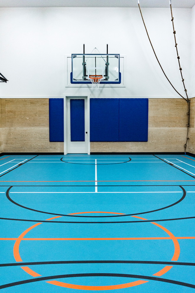 Inspiration for a large industrial indoor sport court in Edmonton with blue floor.