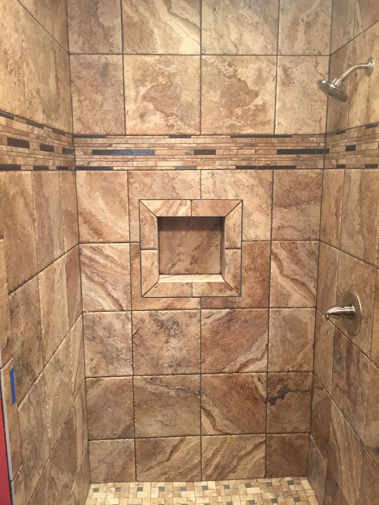 Inspiration for a mid-sized traditional 3/4 bathroom in Other with raised-panel cabinets, light wood cabinets, an alcove shower, brown tile, porcelain tile, red walls, porcelain floors, an undermount sink and granite benchtops.