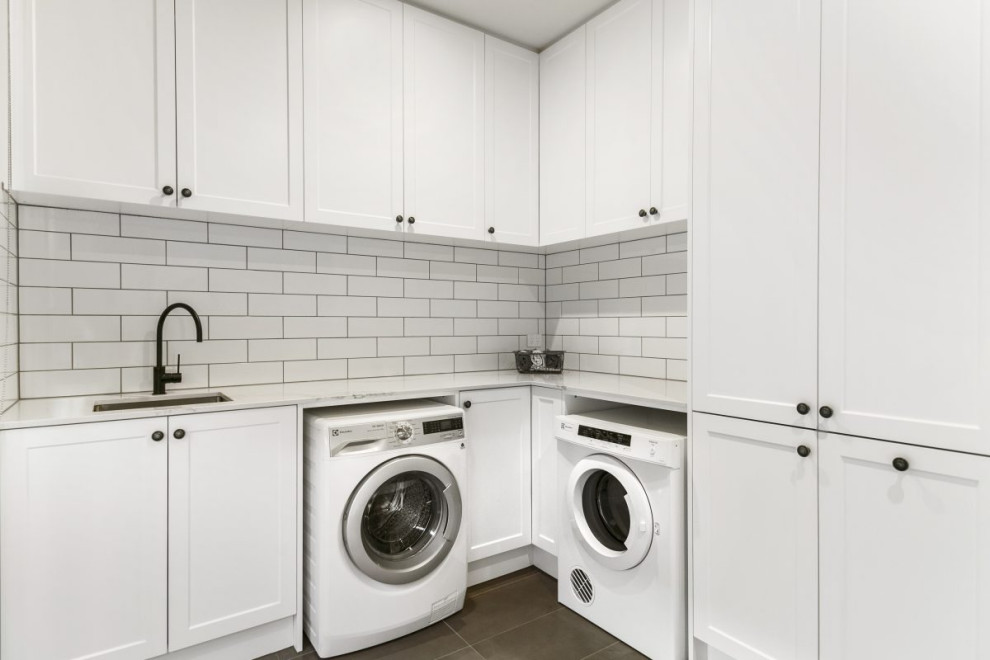 Photo of a transitional laundry room in Other.