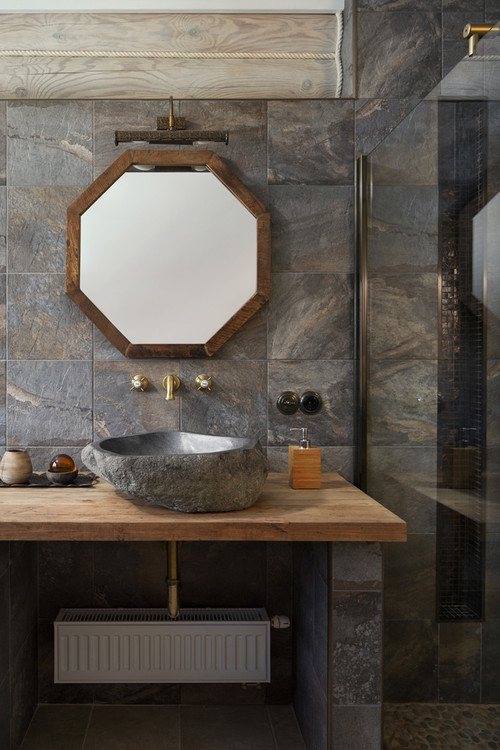 Rustic Harmony: Stone and Wood Backsplash in Farmhouse Bathroom Elegance