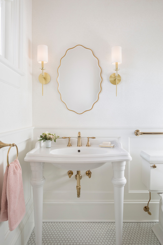 Small traditional powder room in Minneapolis with recessed-panel cabinets, white cabinets, a two-piece toilet, white walls, a console sink and white floor.