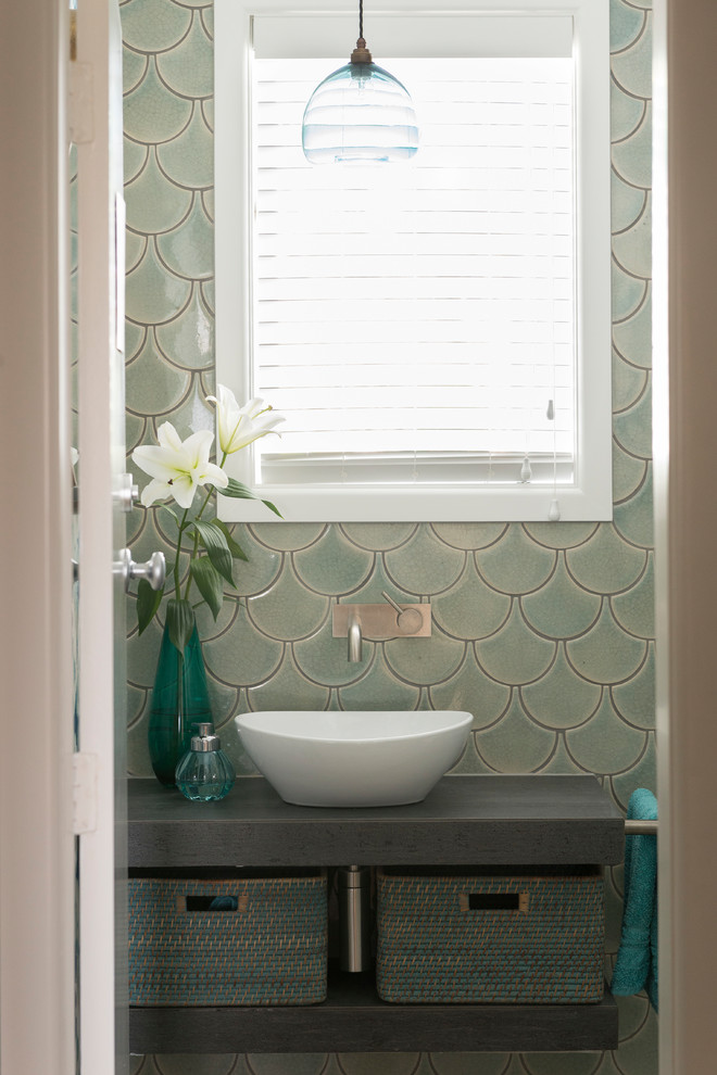 This is an example of a small eclectic 3/4 bathroom in Other with open cabinets, grey cabinets, green tile, ceramic tile, ceramic floors, a vessel sink, tile benchtops, grey floor and blue walls.