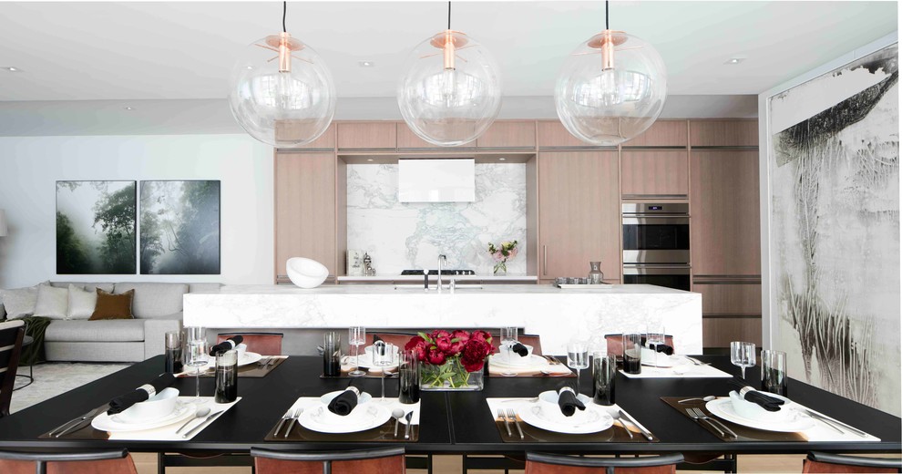 This is an example of a mid-sized contemporary kitchen in New York with with island.