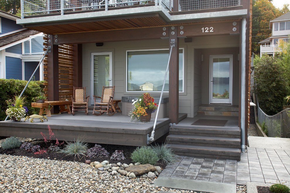 Inspiration for a small contemporary front yard partial sun xeriscape in Seattle with concrete pavers.