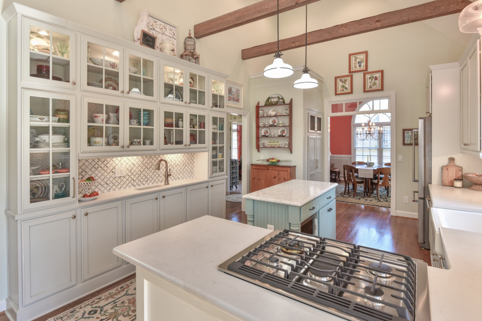 Inspiration for a large traditional u-shaped kitchen in DC Metro with a belfast sink, recessed-panel cabinets, engineered stone countertops, stainless steel appliances and an island.