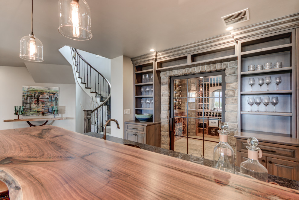 Example of a transitional home design design in Denver