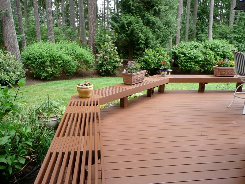 Photo of a large arts and crafts backyard deck in Seattle with no cover.