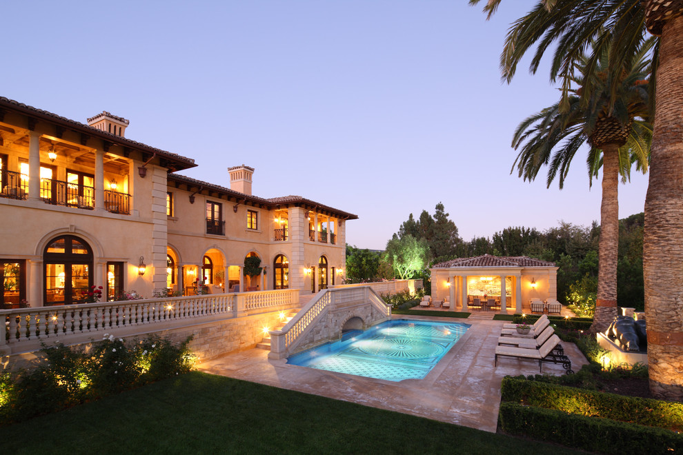 This is an example of a large mediterranean two-storey exterior in Los Angeles.