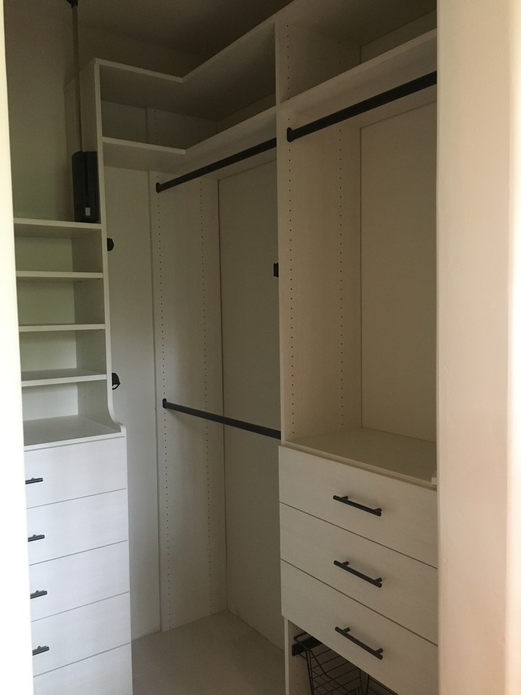 Mid-sized transitional gender-neutral carpeted and gray floor walk-in closet photo in Denver with flat-panel cabinets and white cabinets