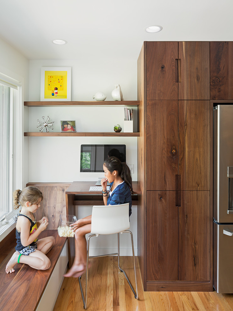 Contemporary kitchen in Philadelphia with dark wood cabinets, wood benchtops and medium hardwood floors.