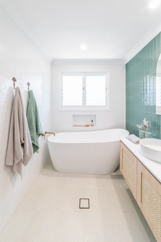 Inspiration for a mid-sized coastal master multicolored tile and ceramic tile porcelain tile, white floor and single-sink bathroom remodel in Other with light wood cabinets, white walls, a vessel sink, solid surface countertops, white countertops, a niche and a floating vanity