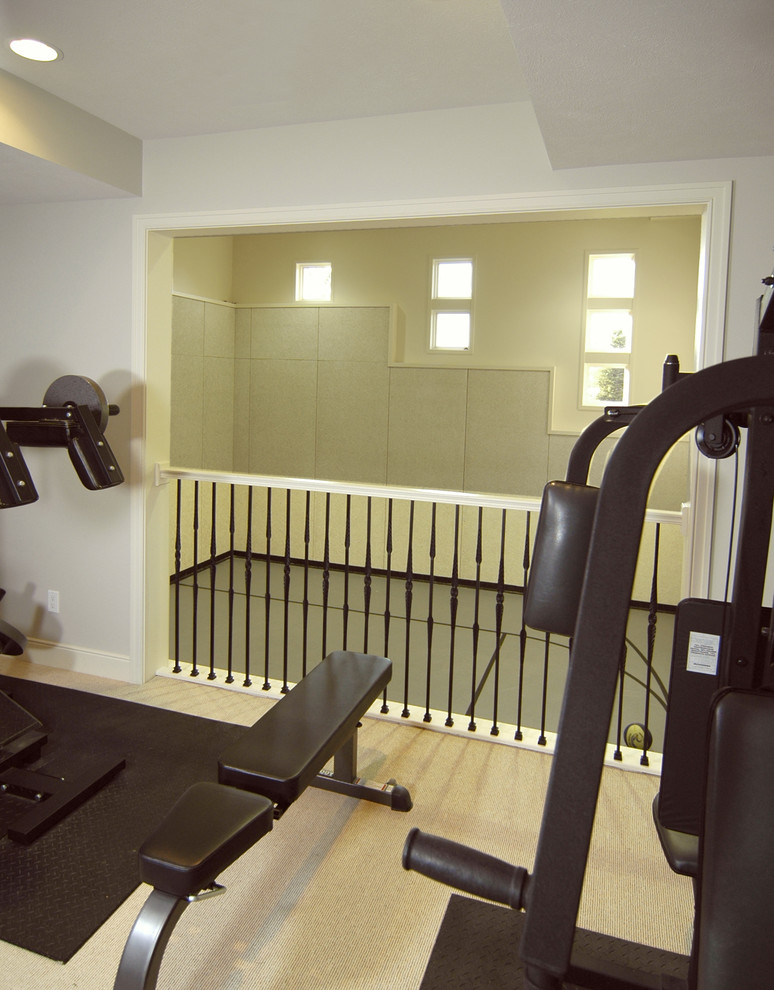 Photo of a country home weight room in Grand Rapids with carpet and beige floor.