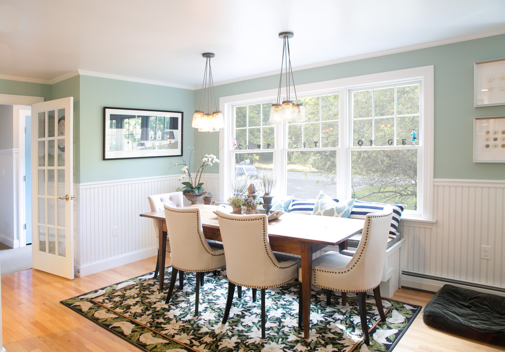 Inspiration for a transitional dining room in Portland Maine with blue walls and medium hardwood floors.