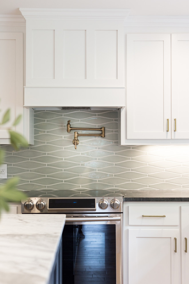Kitchen - eclectic kitchen idea with white cabinets, gray backsplash, ceramic backsplash and an island