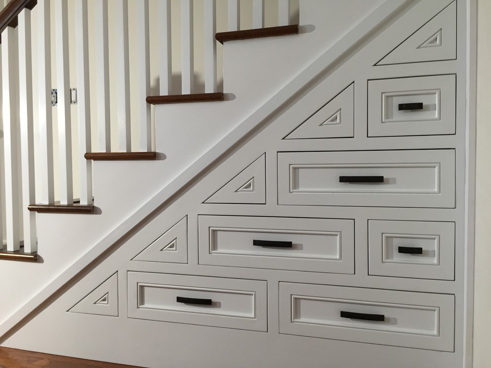 Design ideas for a mid-sized traditional wood straight staircase in Jacksonville with painted wood risers.