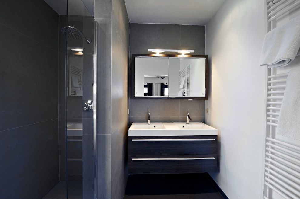 Mid-sized contemporary 3/4 bathroom in Other with flat-panel cabinets, dark wood cabinets, an alcove shower, gray tile, porcelain tile, white walls, dark hardwood floors, an integrated sink, brown floor, white benchtops, a double vanity and a floating vanity.