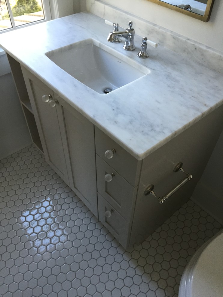 Photo of a country kids bathroom in Atlanta with an undermount sink, shaker cabinets, marble benchtops, white tile, ceramic tile and ceramic floors.