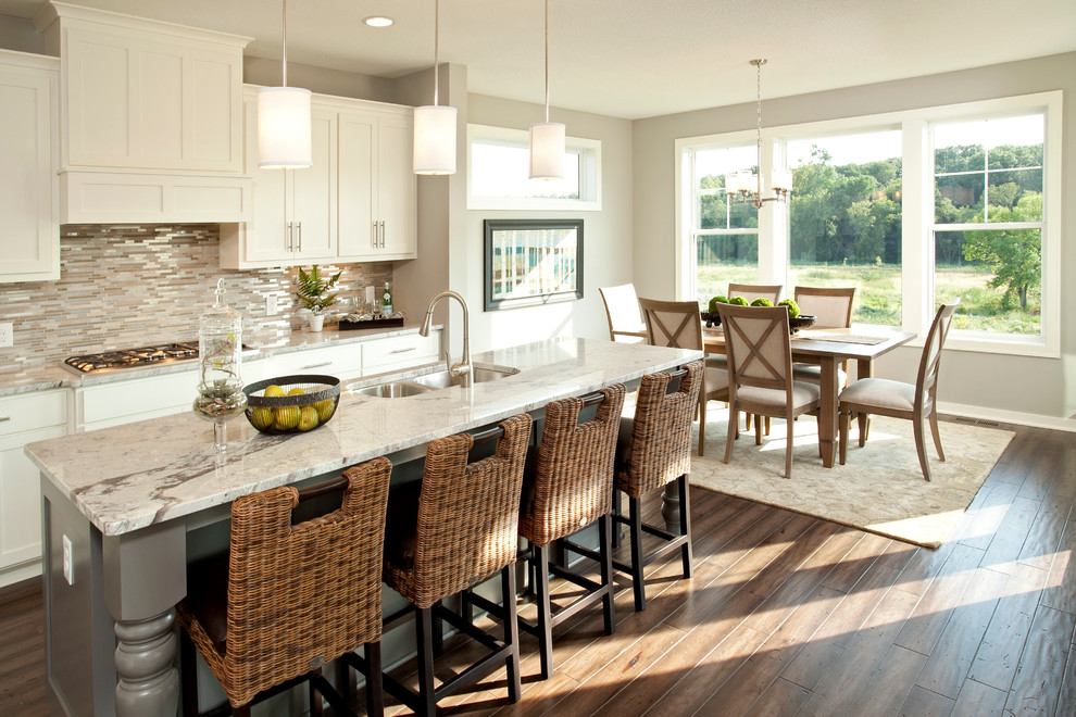 Transitional eat-in kitchen photo in Minneapolis with a double-bowl sink, shaker cabinets, white cabinets, granite countertops, multicolored backsplash, matchstick tile backsplash and gray countertops