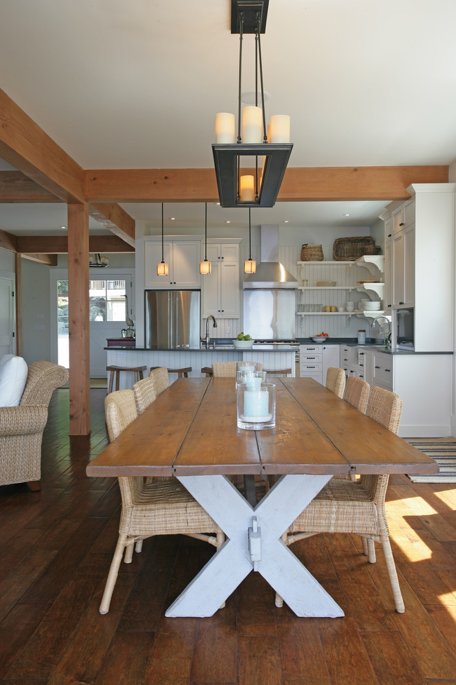 Photo of a beach style open plan dining in Vancouver.