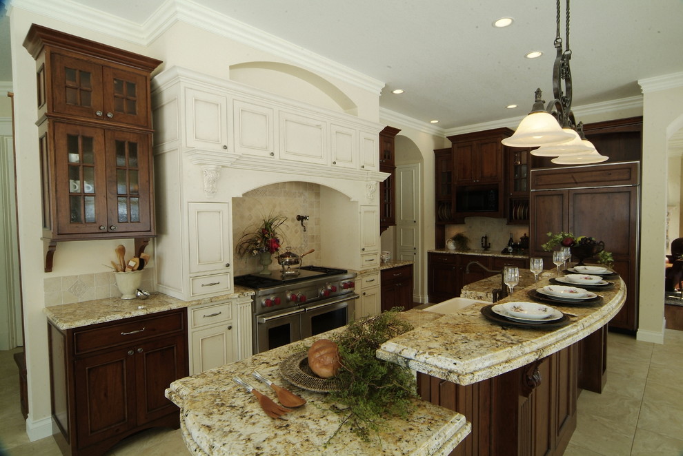 Design ideas for a traditional kitchen in Other with recessed-panel cabinets and stainless steel appliances.