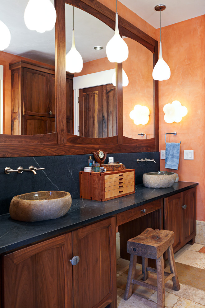 This is an example of a large country master bathroom in Other with a vessel sink, soapstone benchtops, orange walls, recessed-panel cabinets, an alcove shower, a hinged shower door and blue benchtops.