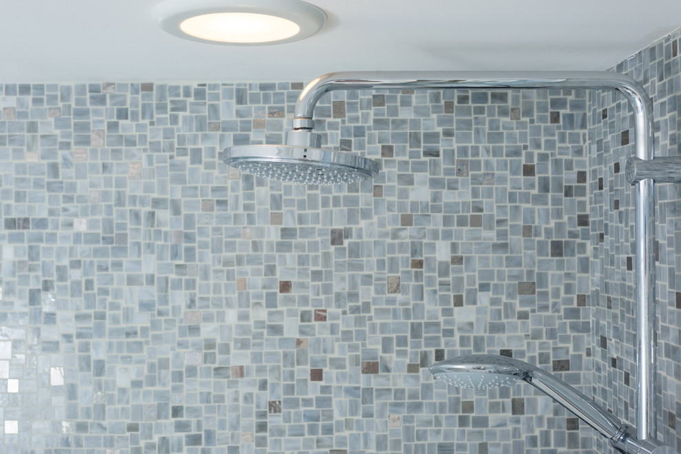 Design ideas for a beach style master bathroom in Providence with blue tile and mosaic tile.