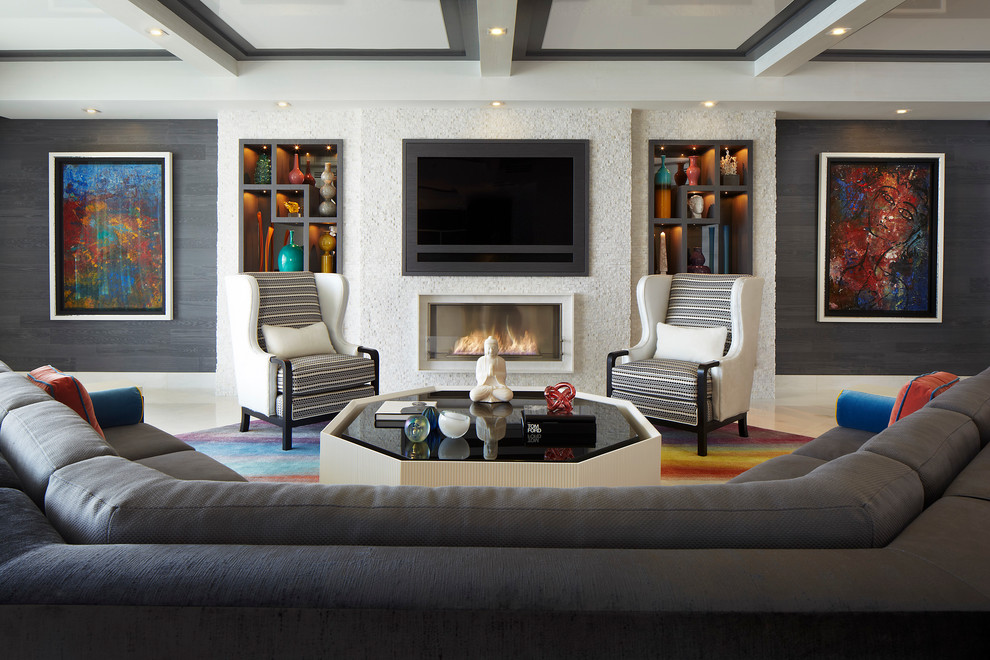 Mid-sized contemporary formal open concept living room in Miami with beige walls, a standard fireplace, a plaster fireplace surround, a wall-mounted tv and white floor.