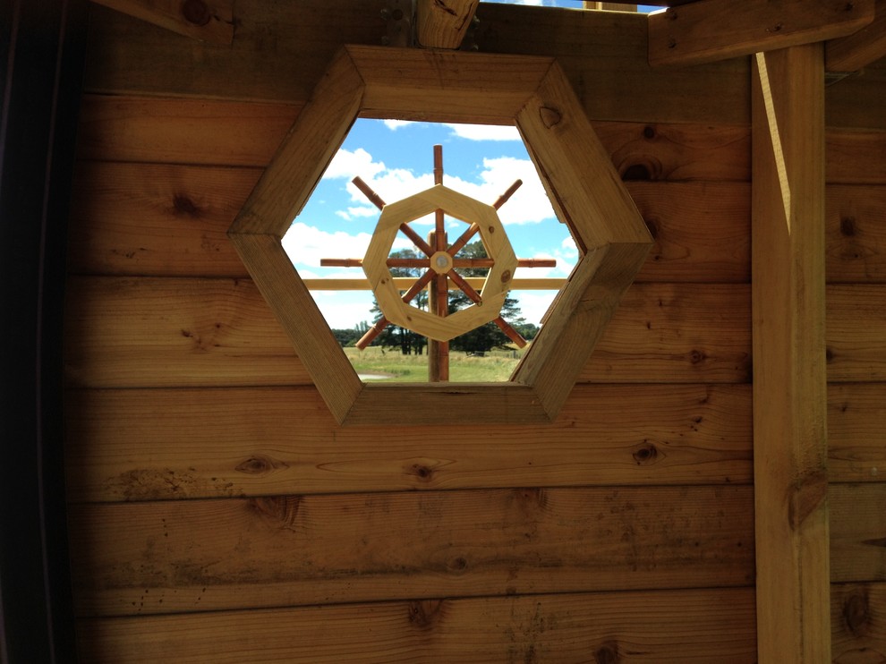 This is an example of a small eclectic kids' playroom in Other.