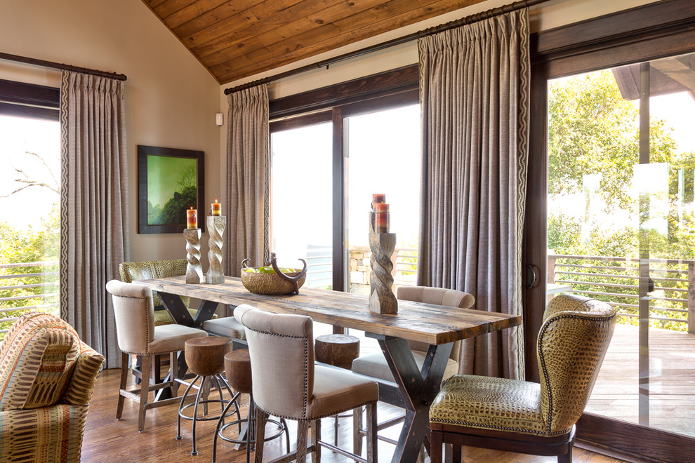 Mid-sized country open plan dining in Charlotte with beige walls and medium hardwood floors.