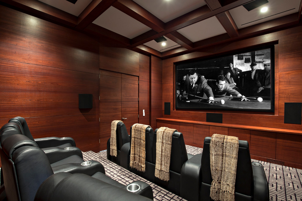Photo of a large contemporary enclosed home theatre in Miami with carpet and a projector screen.