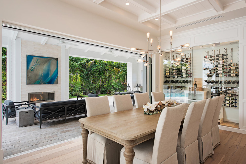 Design ideas for a transitional dining room in Miami with beige walls and medium hardwood floors.
