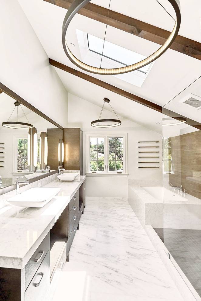 This is an example of a large contemporary master bathroom in San Francisco with flat-panel cabinets, dark wood cabinets, engineered quartz benchtops, an undermount tub, brown tile, porcelain tile, a corner shower, a wall-mount toilet, a vessel sink, an open shower, white walls, marble floors and white floor.
