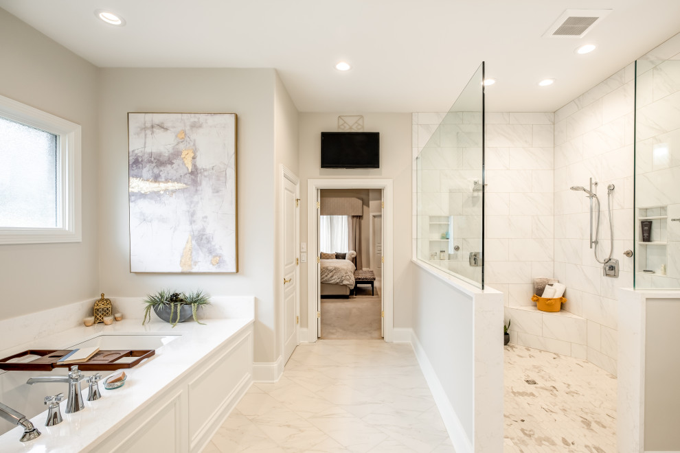This is an example of a large transitional master bathroom in Other with shaker cabinets, medium wood cabinets, an undermount tub, an open shower, a bidet, white tile, porcelain tile, beige walls, ceramic floors, an undermount sink, engineered quartz benchtops, white floor, an open shower, white benchtops, a shower seat, a double vanity and a built-in vanity.