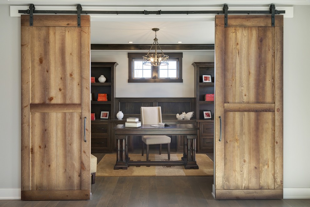 Inspiration for a mid-sized transitional freestanding desk dark wood floor study room remodel in Minneapolis with gray walls and no fireplace