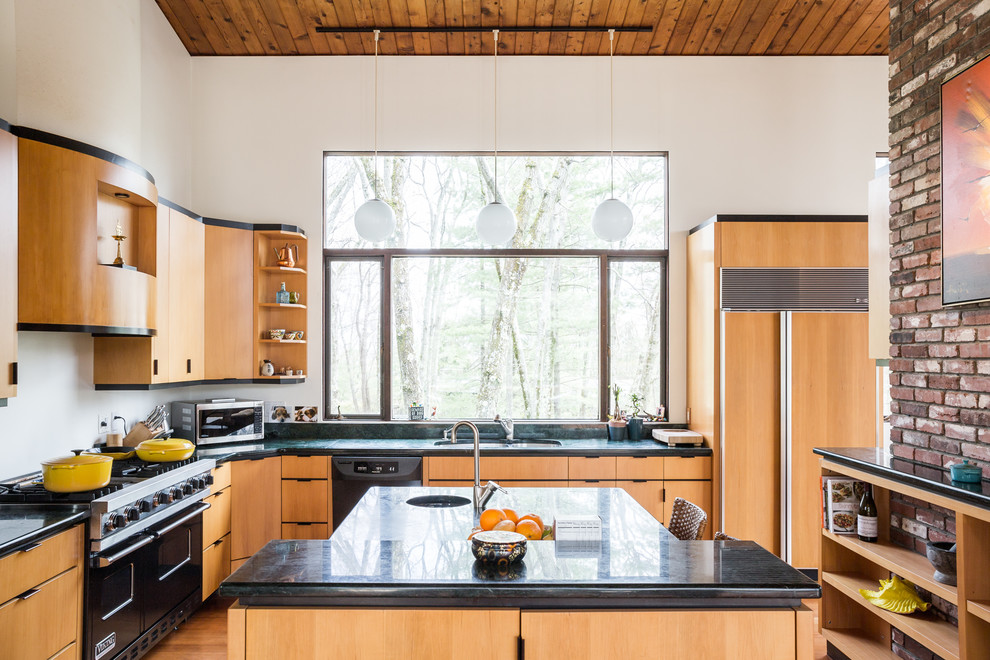 Contemporary l-shaped kitchen in Boston with an undermount sink, flat-panel cabinets, light wood cabinets, black appliances, medium hardwood floors and with island.