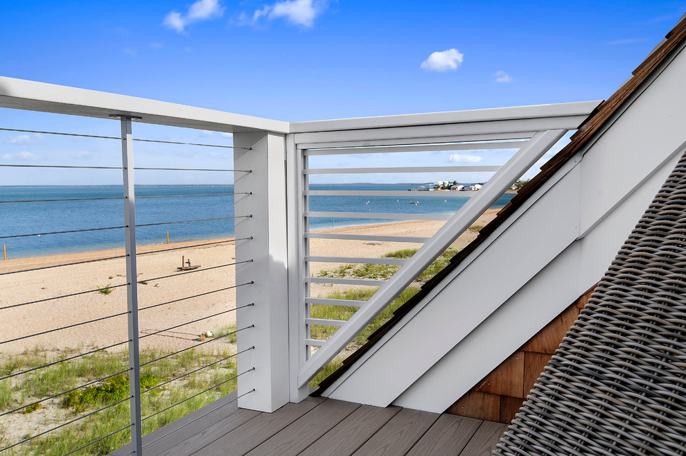Deck - coastal backyard deck idea with no cover
