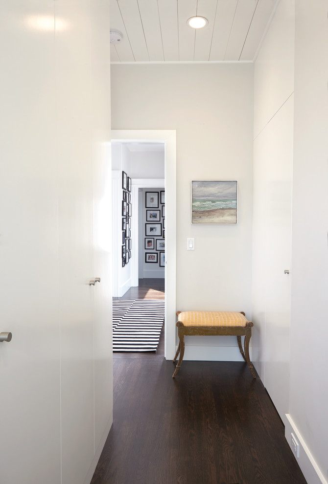 Inspiration for a mid-sized contemporary hallway in San Francisco with white walls and dark hardwood floors.